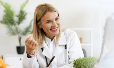 Montana family nurse practitioner smiling with pediatric patient during appointment